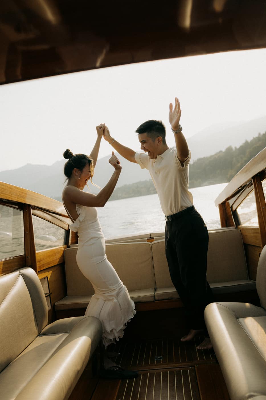 Julia and Jerome dancing on a boat on Lake Como